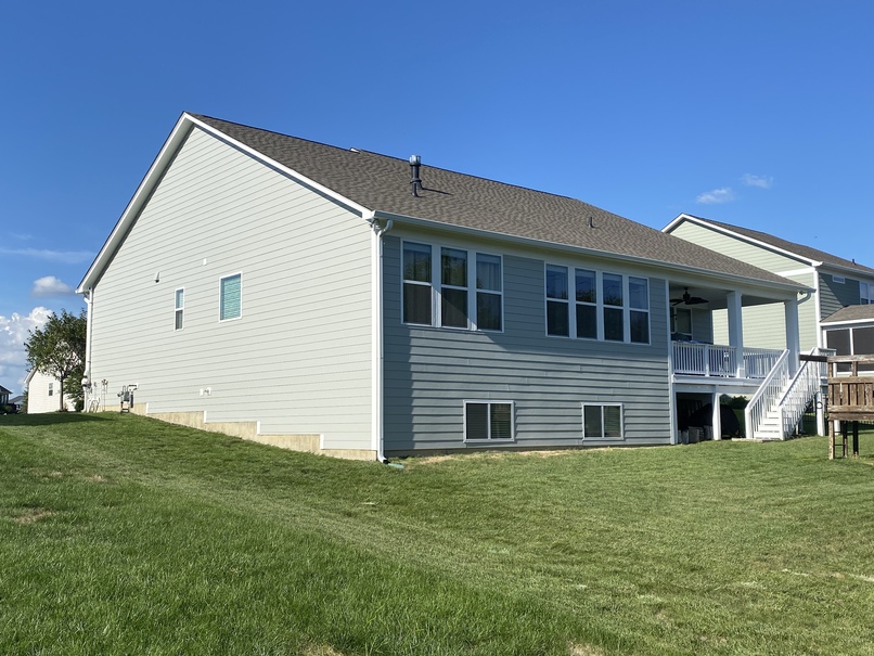 Rear of home with siding all around