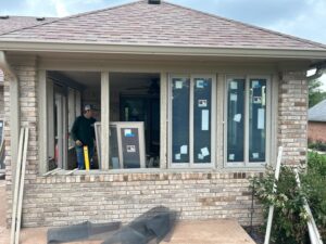 A porch conversion being completed and the windows installed.