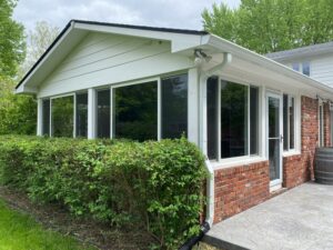 A brand new porch conversion with new white windows.