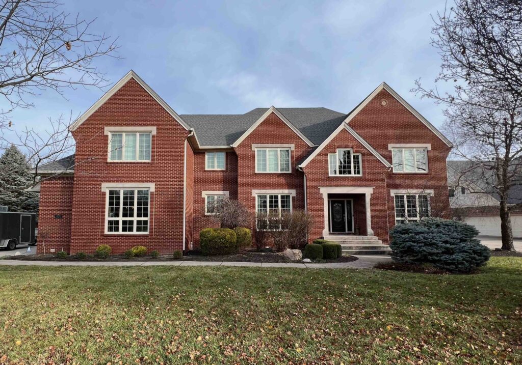 Front elevation of stately red home