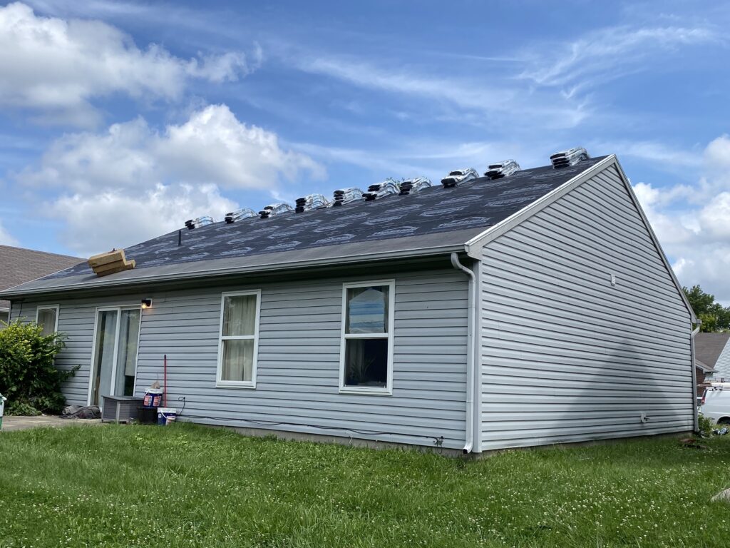 Home with roof being replaced