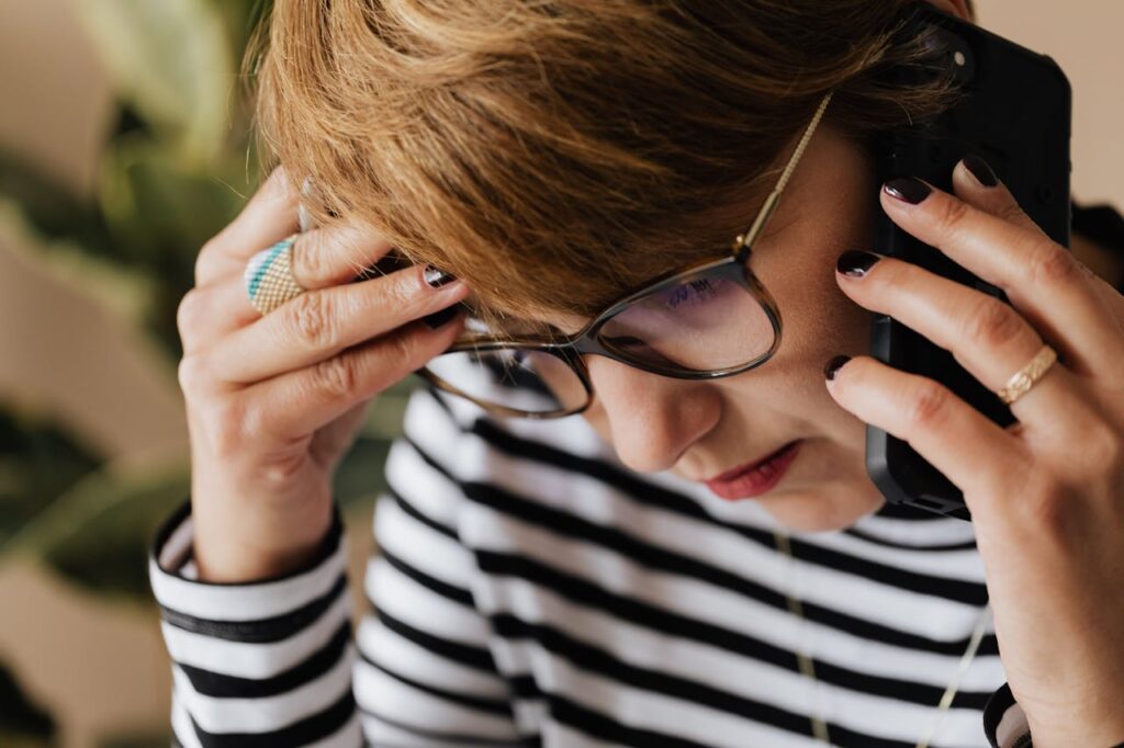 Person talking on phone concerned
