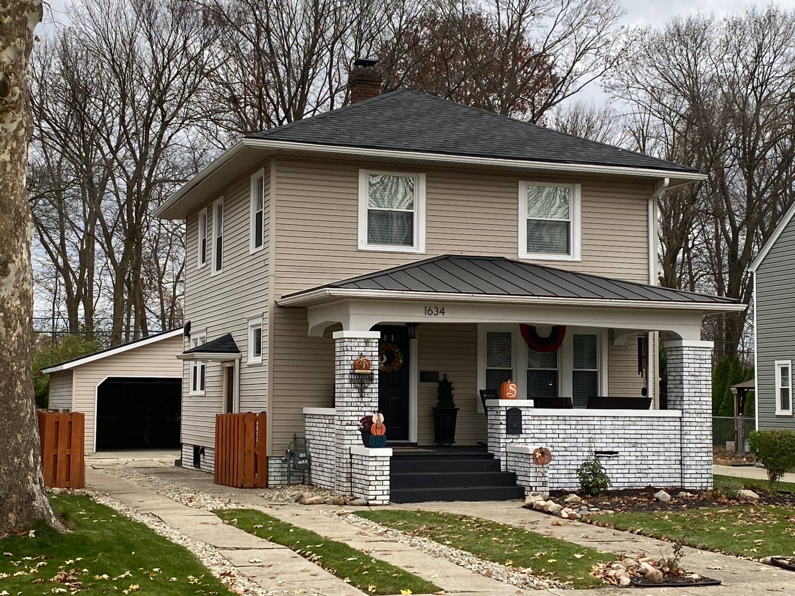 A charming, well-kept South Bend, IN home exterior with a lush green lawn